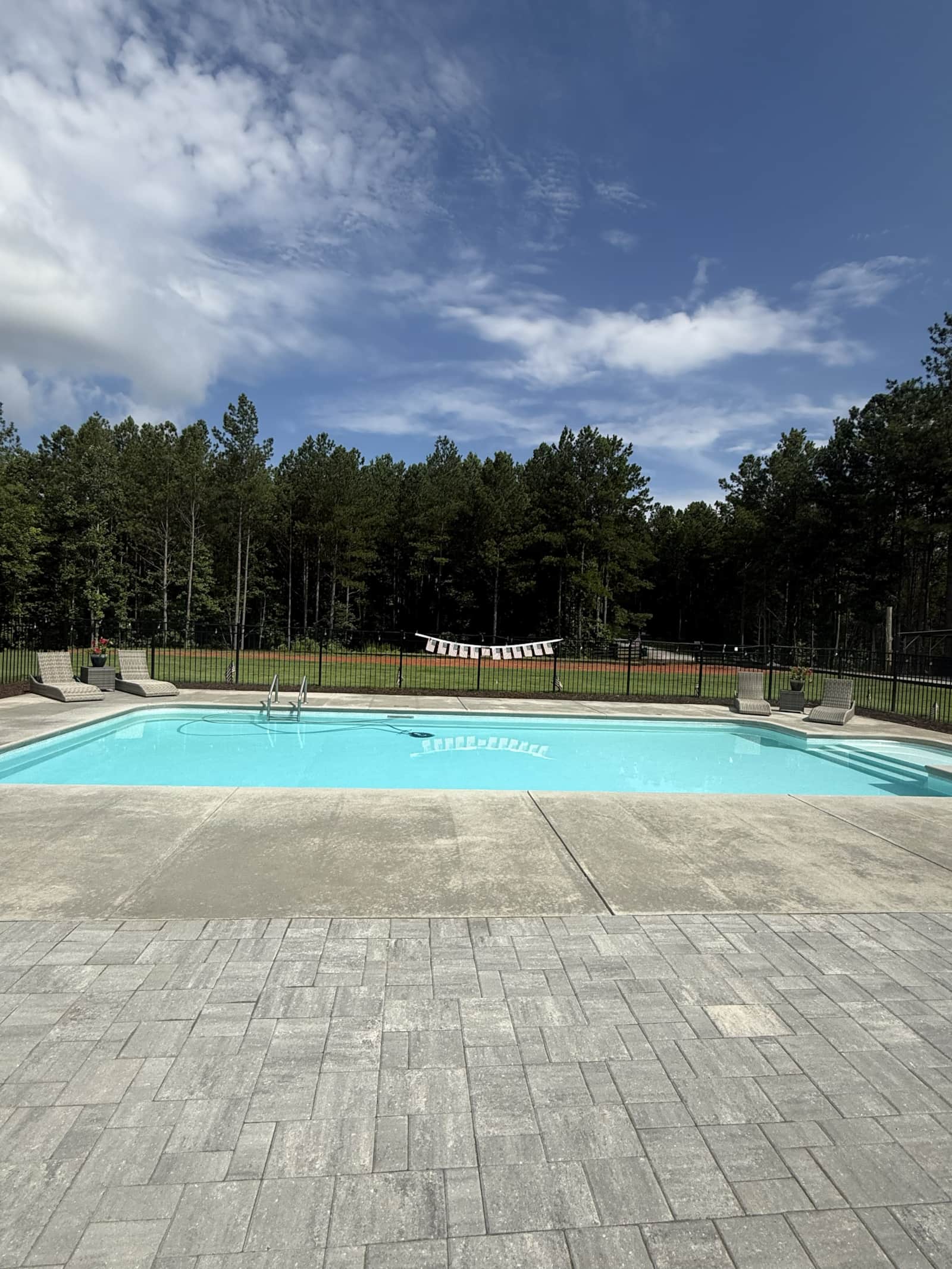 The private pool at Sanctuary 120, surrounded by trees